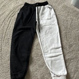 Split black and white sweatpants